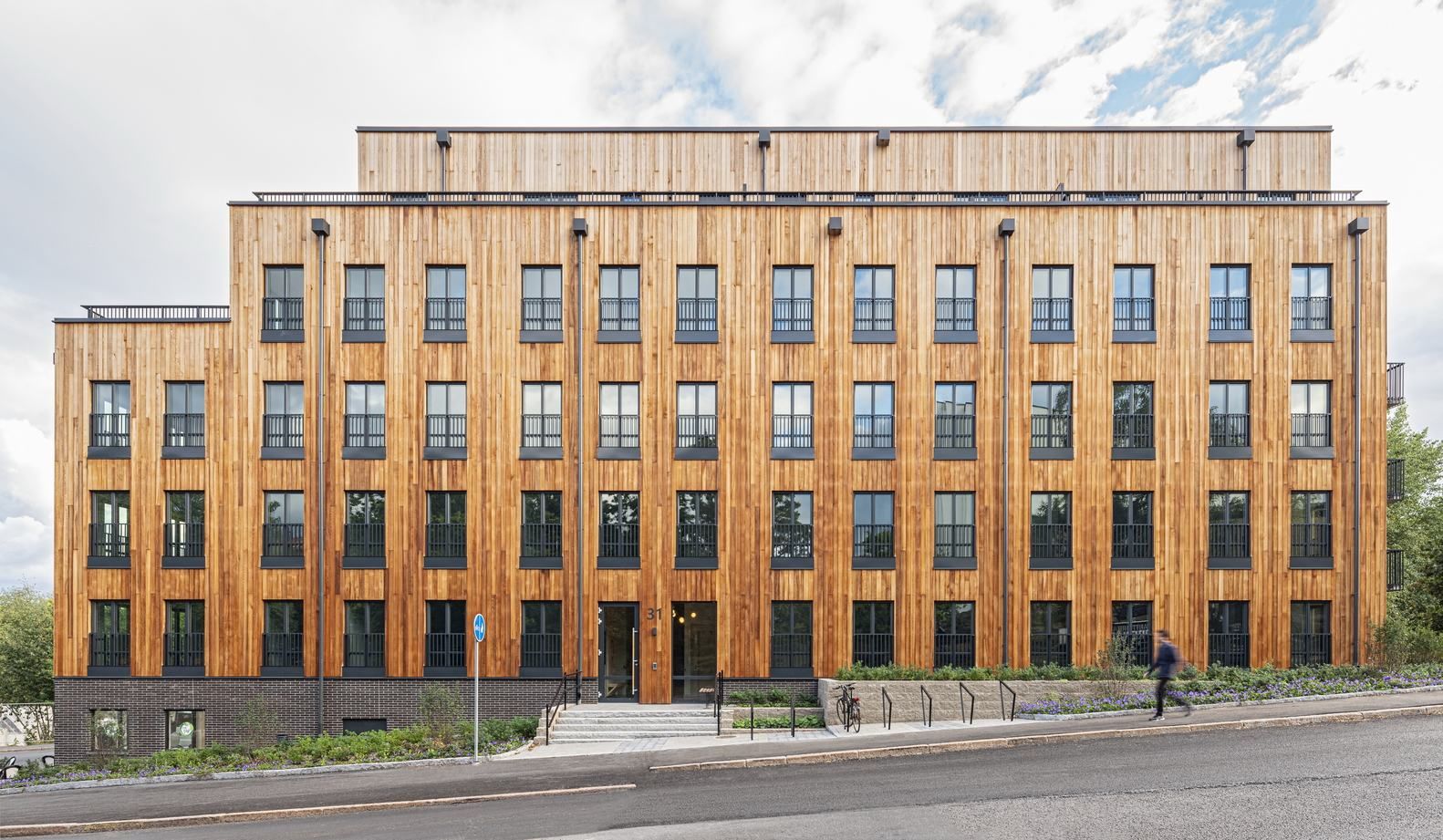 Деревянный уют: многоквартирный дом из особых материалов Деревянный уют: многоквартирный дом из особых материалов